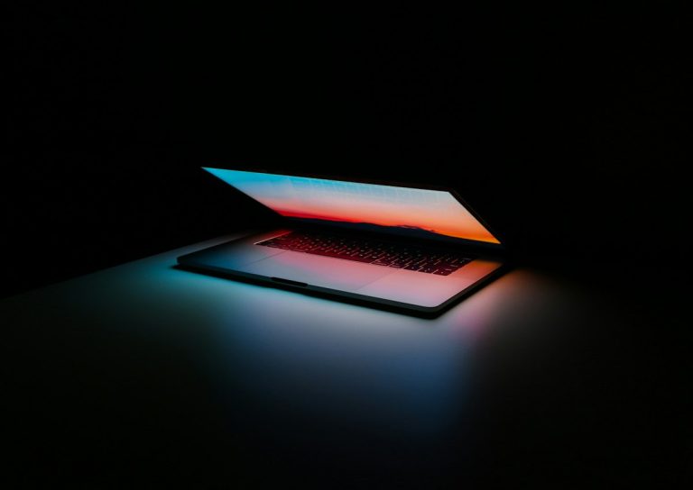 Sleek modern laptop and wireless device demonstrating high speed dual-band wireless routing